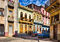 Parked autos on quiet street of Havana