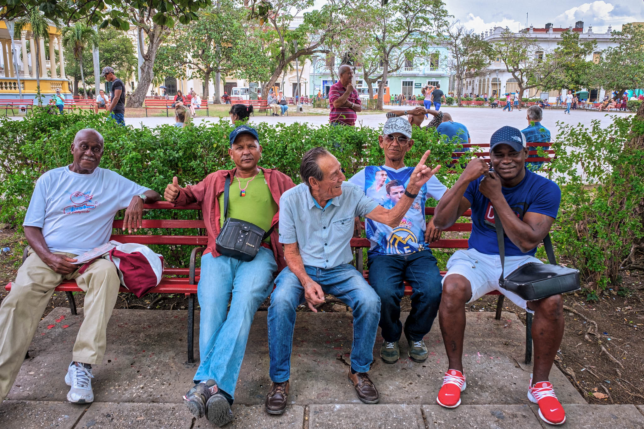 Men on park bench in Parque Vidal in Santa Clara Cuba